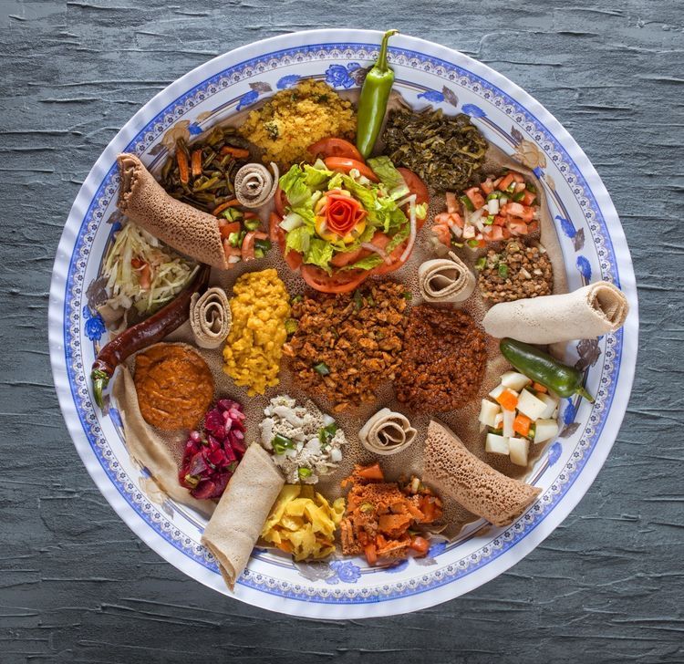 Traditional Ethiopian injera platter with colorful stews
